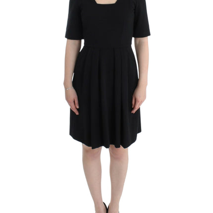 CO|TE Black short sleeve venus dress