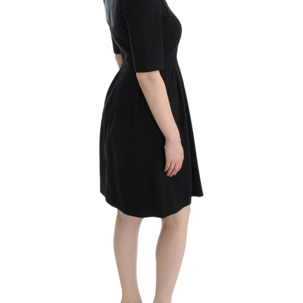 CO|TE Black short sleeve venus dress