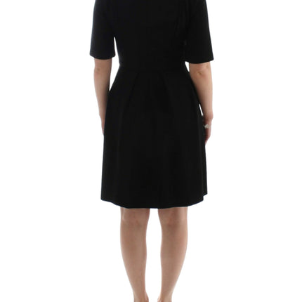 CO|TE Black short sleeve venus dress